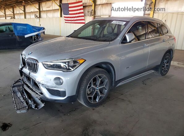 WBXHU7C36J5H42208 2018 BMW X1 Серебряный Передняя левая четверть