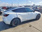 2023 Tesla Model Y White vin: 7SAYGDEE0PA052489