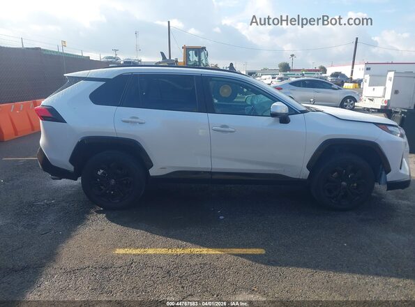 2T3T6RFV3PW045345 2023 TOYOTA RAV4 HYBRID White Widok wnętrza z tyłu