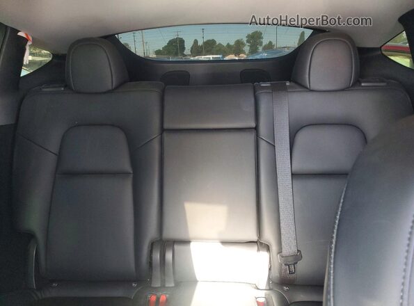 7SAYGDEE0PA052489 2023 TESLA MODEL Y White Widok wnętrza z tyłu
