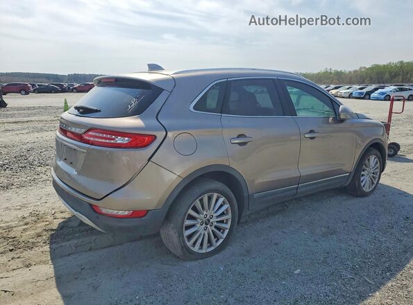5LMCJ1C93KUL17267 2019 LINCOLN MKC Бежевый Передняя правая четверть