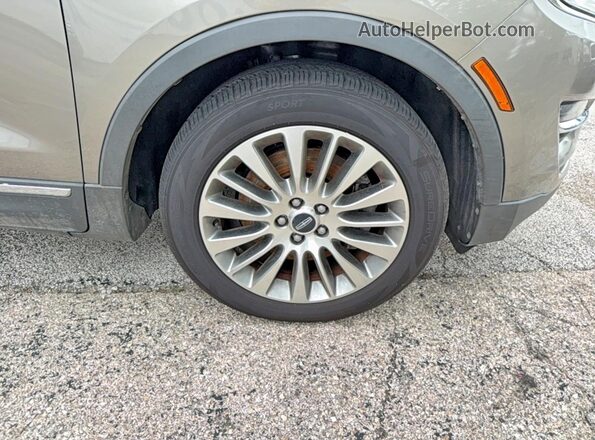 5LMCJ3D90HUL69989 2017 LINCOLN MKC Brown Вид наклейки з VIN-кодом