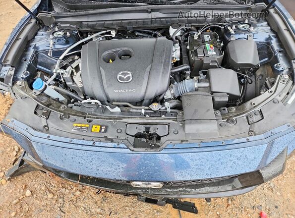 7MMVABEM5RN184524 2024 MAZDA CX-5 Blue Rear interior view