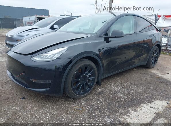 7SAYGAEE6NF315261 2022 TESLA MODEL Y Black წინა მარცხენა ხედი სამი მეოთხედიდან