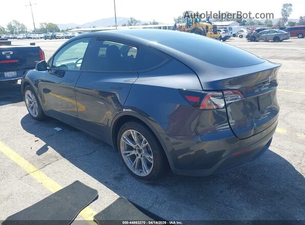 7SAYGAEE8RF034696 2024 TESLA MODEL Y Gray Trasero izquierdo