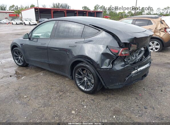 7SAYGDED0SF228847 2025 TESLA MODEL Y Gray Trasero izquierdo