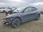 2026 Tesla Model Y Gray vin: 7SAYGDED0TF459121