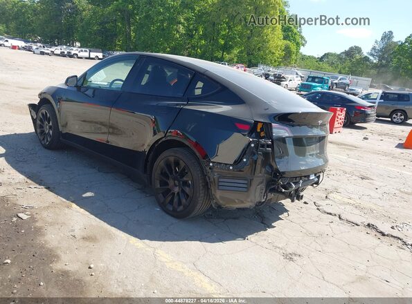 7SAYGDEE0PA116319 2023 TESLA MODEL Y Black Trasero izquierdo