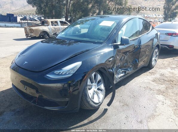 7SAYGDEE5PA024493 2023 TESLA MODEL Y Black Vista tres cuartos delantera izquierda