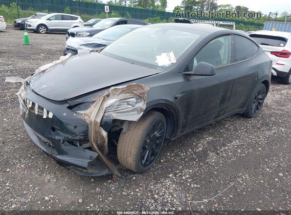 7SAYGDEE6PA180980 2023 TESLA MODEL Y Black Przód lewy