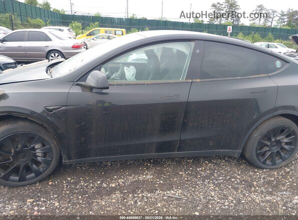 7SAYGDEE6PA180980 2023 TESLA MODEL Y Black Widok wnętrza z tyłu