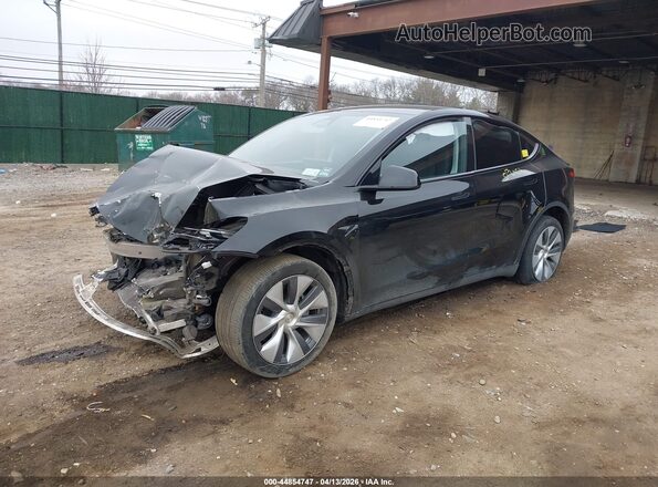 7SAYGDEE8PA182939 2023 TESLA MODEL Y Black Vista tres cuartos delantera izquierda