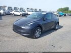 2024 Tesla Model Y Long Range Dual Motor All-wheel Drive Gray vin: 7SAYGDEEXRA262679