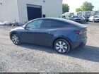 2024 Tesla Model Y Long Range Dual Motor All-wheel Drive Gray vin: 7SAYGDEEXRA262679
