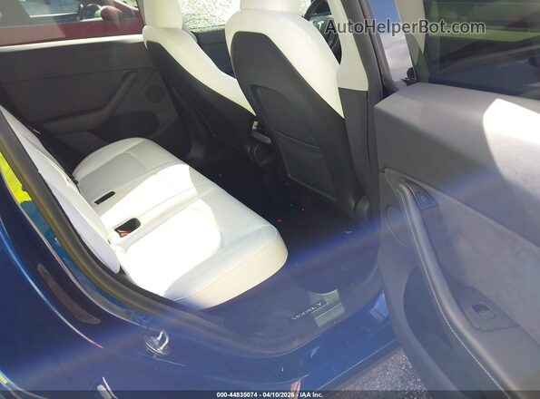7SAYGDEF1RA285373 2024 TESLA MODEL Y Blue Widok naklejki z numerem VIN