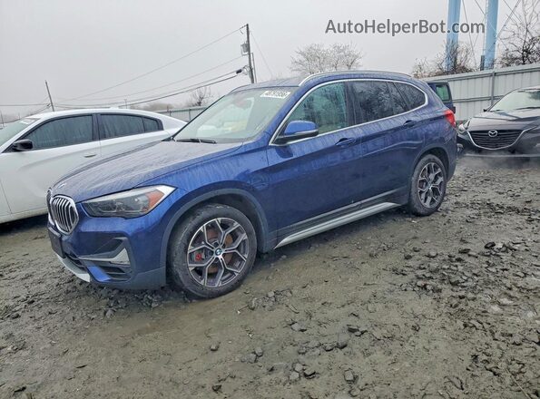 WBXJG9C07L5P84395 2020 BMW X1 Синий Передняя левая четверть