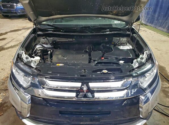 JA4AD2A3XJZ052000 2018 MITSUBISHI OUTLANDER Silver Vista de la etiqueta del VIN