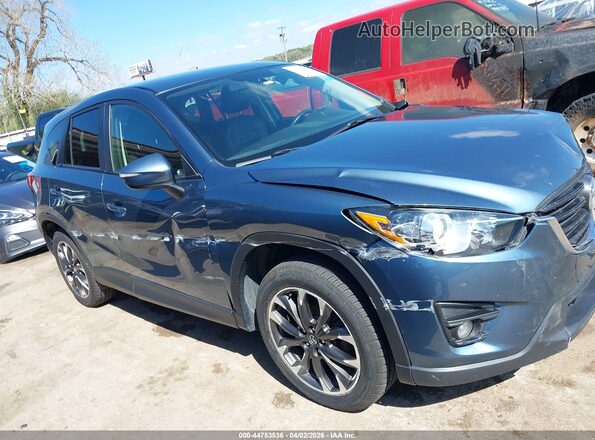 JM3KE4DY4G0789062 2016 MAZDA CX-5 Blue Widok wnętrza z tyłu