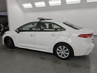 2022 Toyota Corolla Le White vin: JTDEPMAE7N3001106 Damage: Left Front Wheel Cover, Broken, Replacement Required
