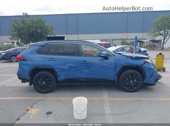 JTM16RFV8PD088972 2023 TOYOTA RAV4 HYBRID Blue Вид задньої частини салону