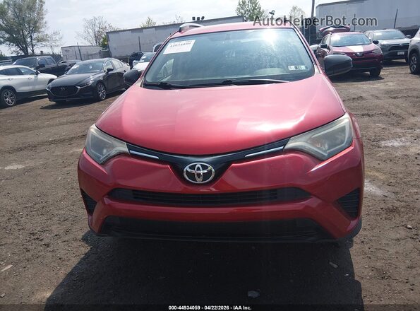 JTMBFREV6GJ090372 2016 TOYOTA LE Red Widok wnętrza z tyłu