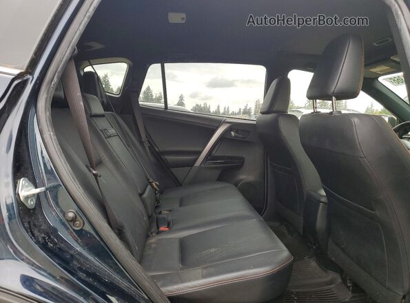 JTMJJREV7JD217582 2018 TOYOTA RAV4 Blue Vista interior trasera