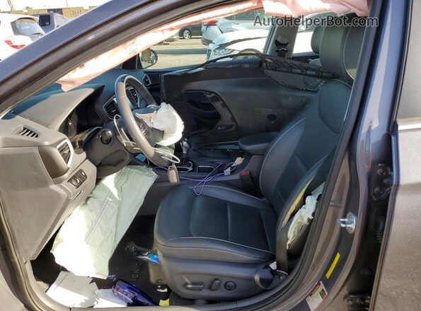 KMHC85LC1JU083128 2018 HYUNDAI IONIQ Gray Vista interior delantera