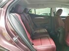 2025 Buick Envision Sport Touring Burgundy vin: LRBFZLE48SD028183