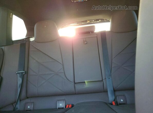 WB523CF04RCN52035 2024 BMW IX Black Vista de los asientos traseros