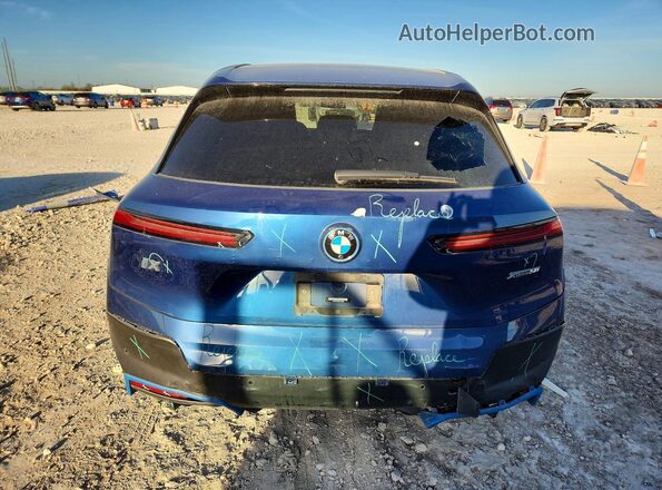 WB523CF05PCL75699 2023 BMW IX Blue Rear view