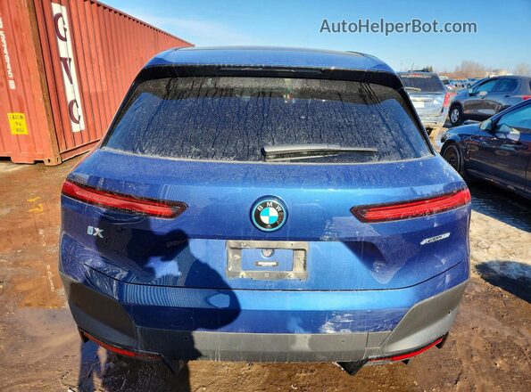 WB523CF07PCM89607 2023 BMW IX Blue Widok z tyłu
