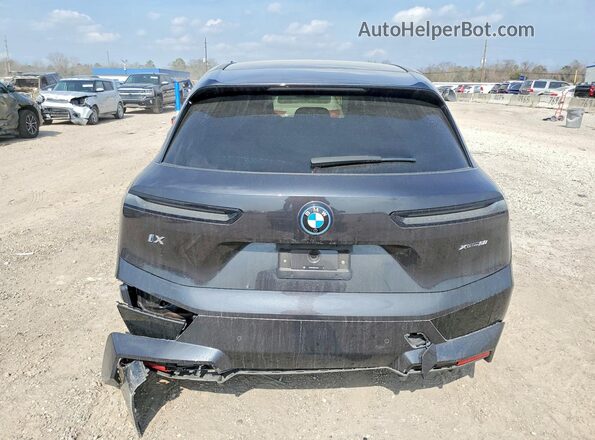 WB523CF08SCS74858 2025 BMW IX Black Vista trasera