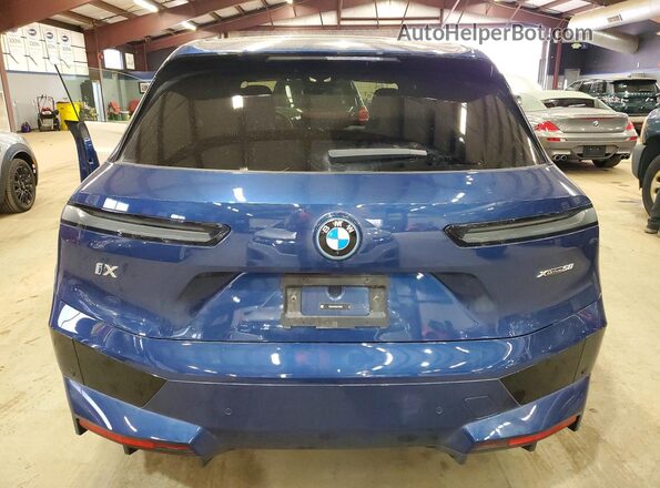 WB523CF08SCU04038 2025 BMW IX Blue Rear view