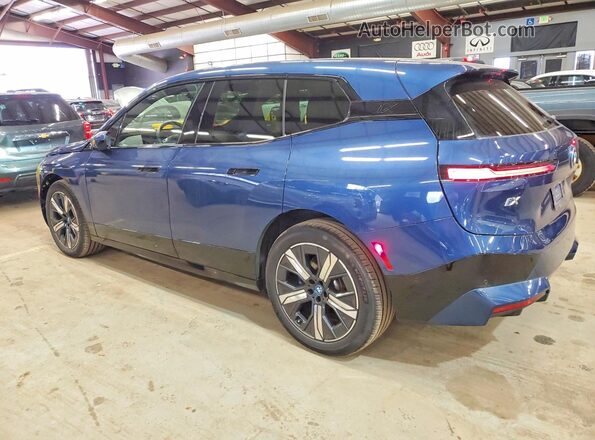 WB523CF08SCU04038 2025 BMW IX Blue Rear left