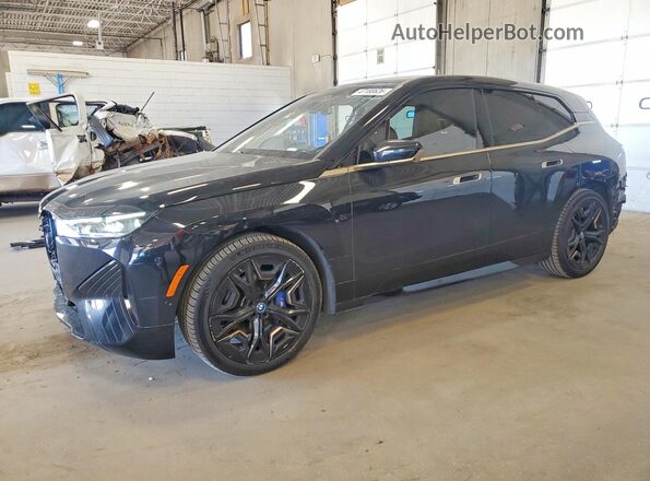 WB533CF00PCM70871 2023 BMW IX Black Առջևի ձախ երեք քառորդ տեսարան