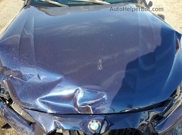 WBA83AP07NCL08663 2022 BMW M4 Blue Rear interior view