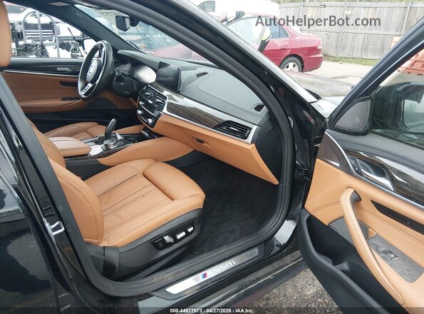 WBAJS7C06LCE09366 2020 BMW OTHER Black Front interior view