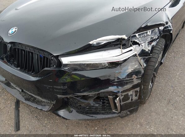 WBAJS7C06LCE09366 2020 BMW OTHER Black Front view