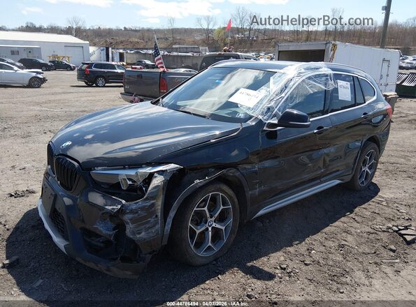 WBXHT3C30H5F73664 2017 BMW X1 Black Przód lewy