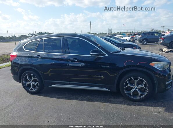 WBXHT3C38G5E52850 2016 BMW X1 Black Вид задньої частини салону