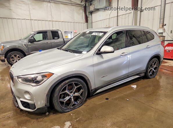 WBXHT3C38G5E56512 2016 BMW X1 Серебряный Передняя левая четверть