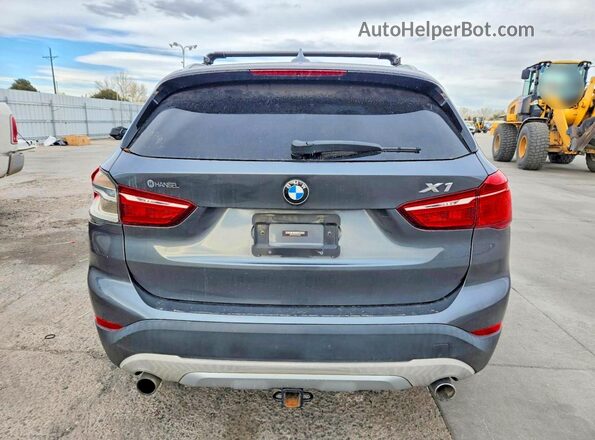 WBXHT3C38H5F69085 2017 BMW X1 Gray Vista trasera