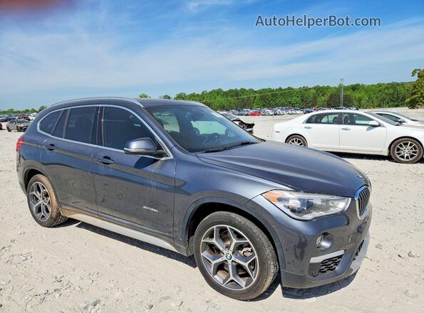 WBXHT3C38H5F85903 2017 BMW X1 Серый Передняя правая четверть