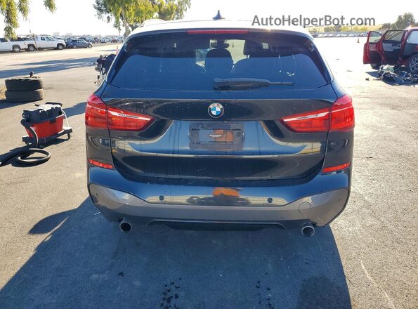 WBXHT3C39H5F73579 2017 BMW X1 Черный Вид сзади