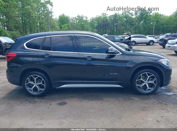 WBXHT3C39J5F93370 2018 BMW X1 Black Սալոնի հետևի տեսք