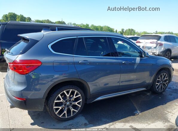 WBXJG7C09M5S08085 2021 BMW X1 Gray Rear interior view