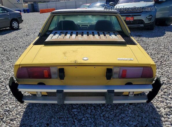 128AS0055503 1976 FIAT UK Yellow Rear view