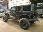 2016 Jeep Wrangler Unlimited Rubicon Черный vin: 1C4HJWFG2GL109429