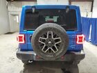 2024 Jeep Wrangler Sahara Blue vin: 1C4PJXEG2RW253633 Damage: R Bumper Textured, Heavy Scratch, 1/2 To 1 Inch