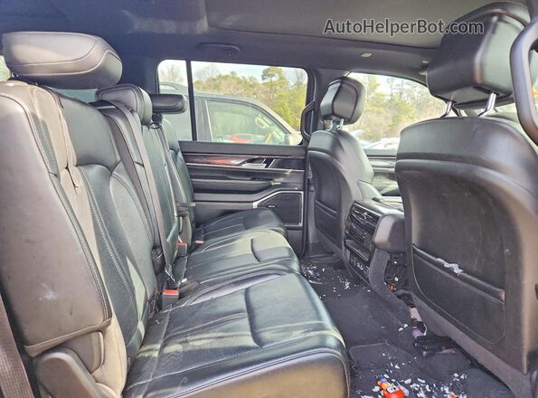 1C4SJSAP7PS569360 2023 JEEP WAGONEER Maroon Rear interior view